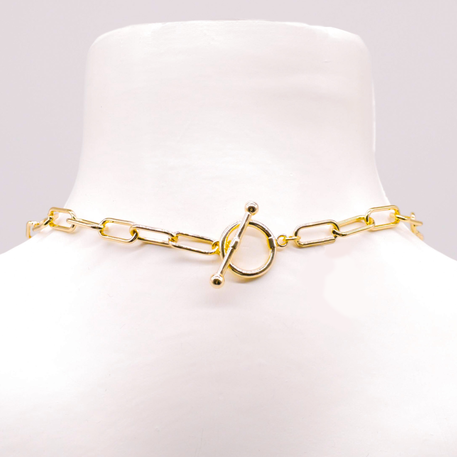 "Charmkette" kurze Kette mit rechteckigen Gliedern, Knebelverschluss, vergoldet