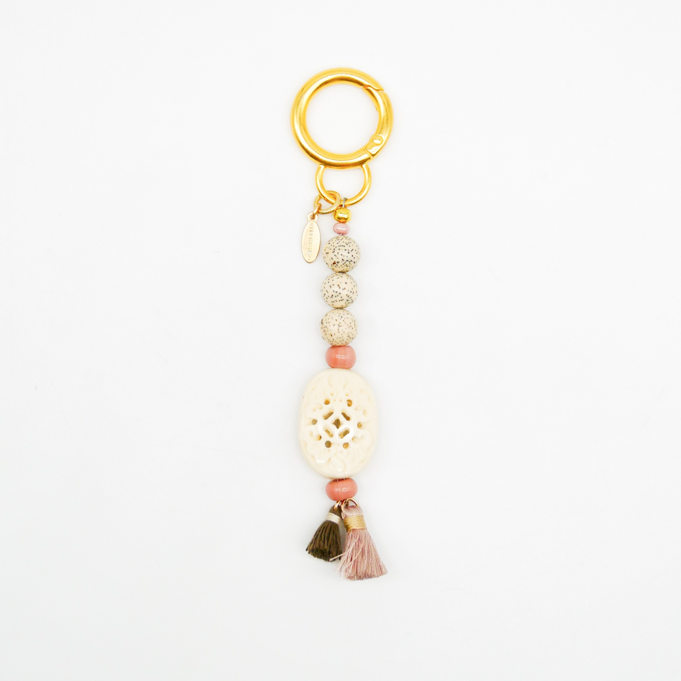 "Lucky Pendant" Anhänger, 1 Strang Glasperlen und Knochenperle, zwei Puschel 