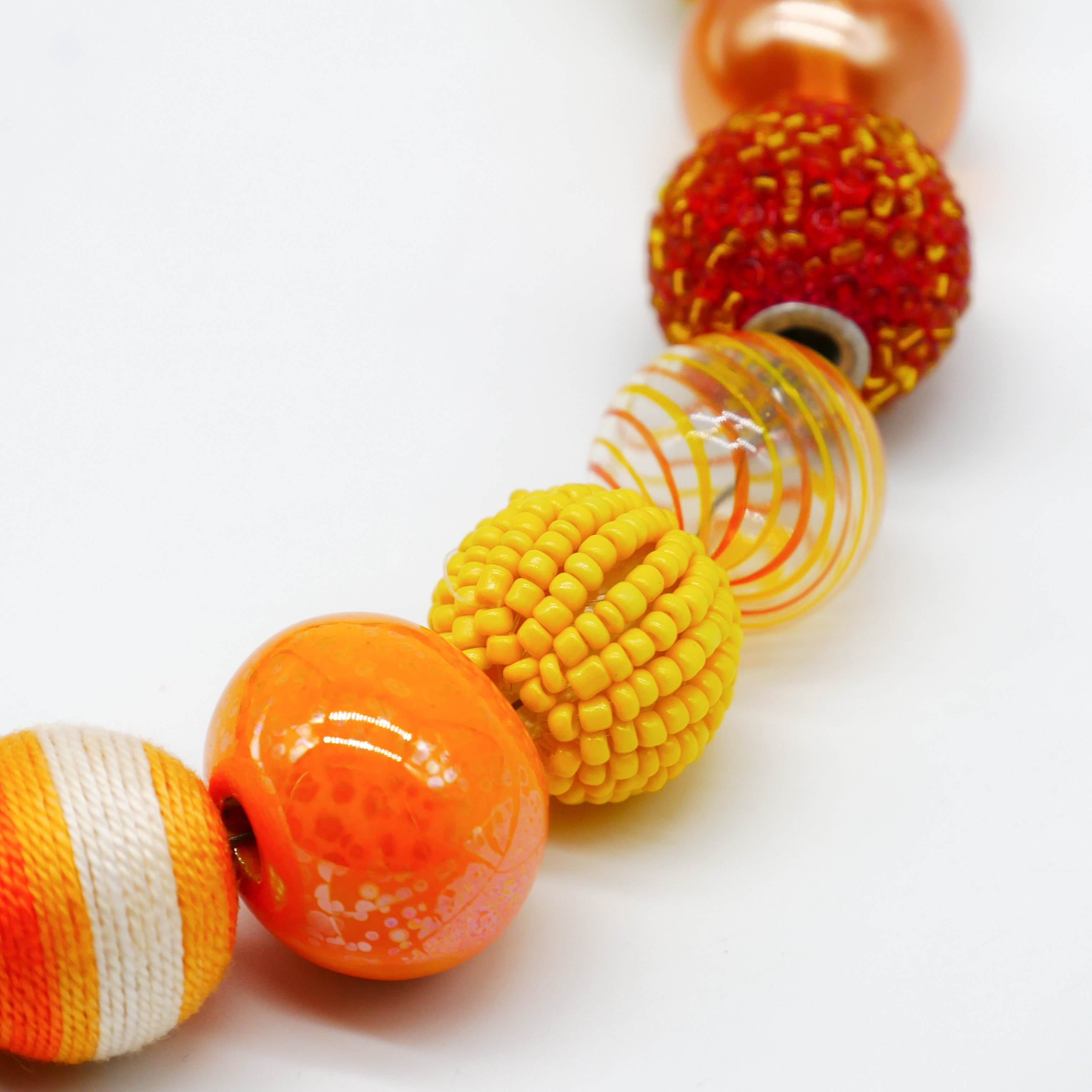 "Bollywood" Kette Ø ca. 20 mm, gelb-orange