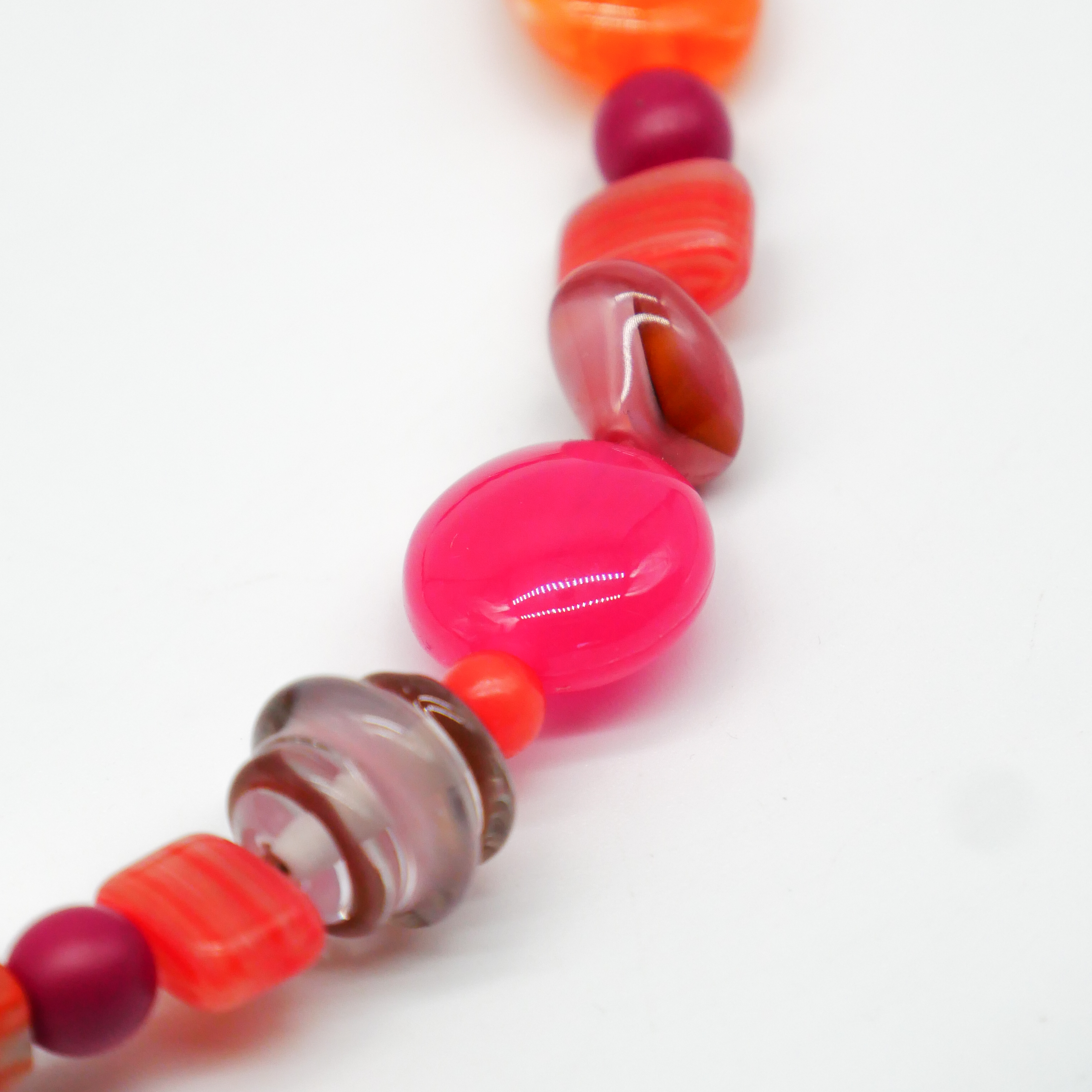 "Summer Feeling",  Chain with different shapes, Glas- and Resin Pearls, pink-orange