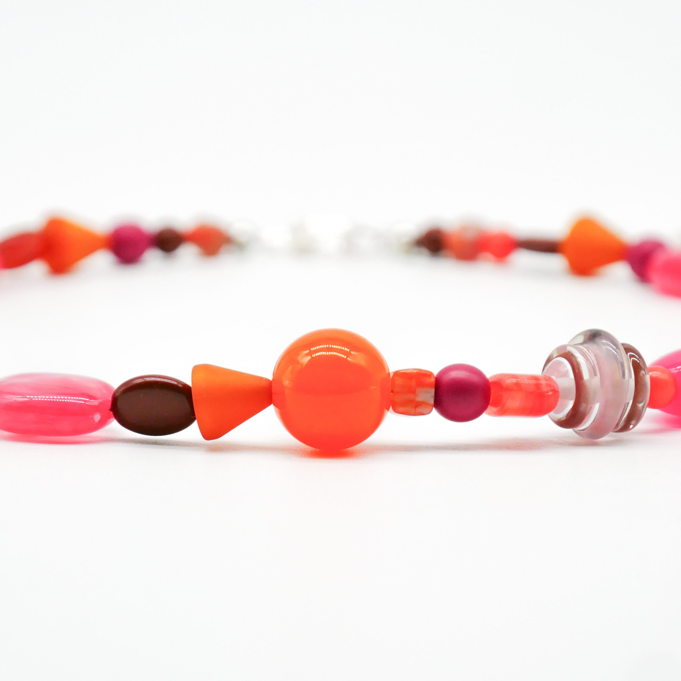 "Summer Feeling",  Chain with different shapes, Glas- and Resin Pearls, pink-orange