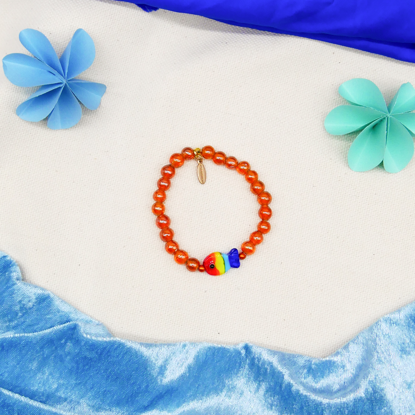 "Summer Feeling" Armband auf Gummi "Fisch" Glasperlen bernstein