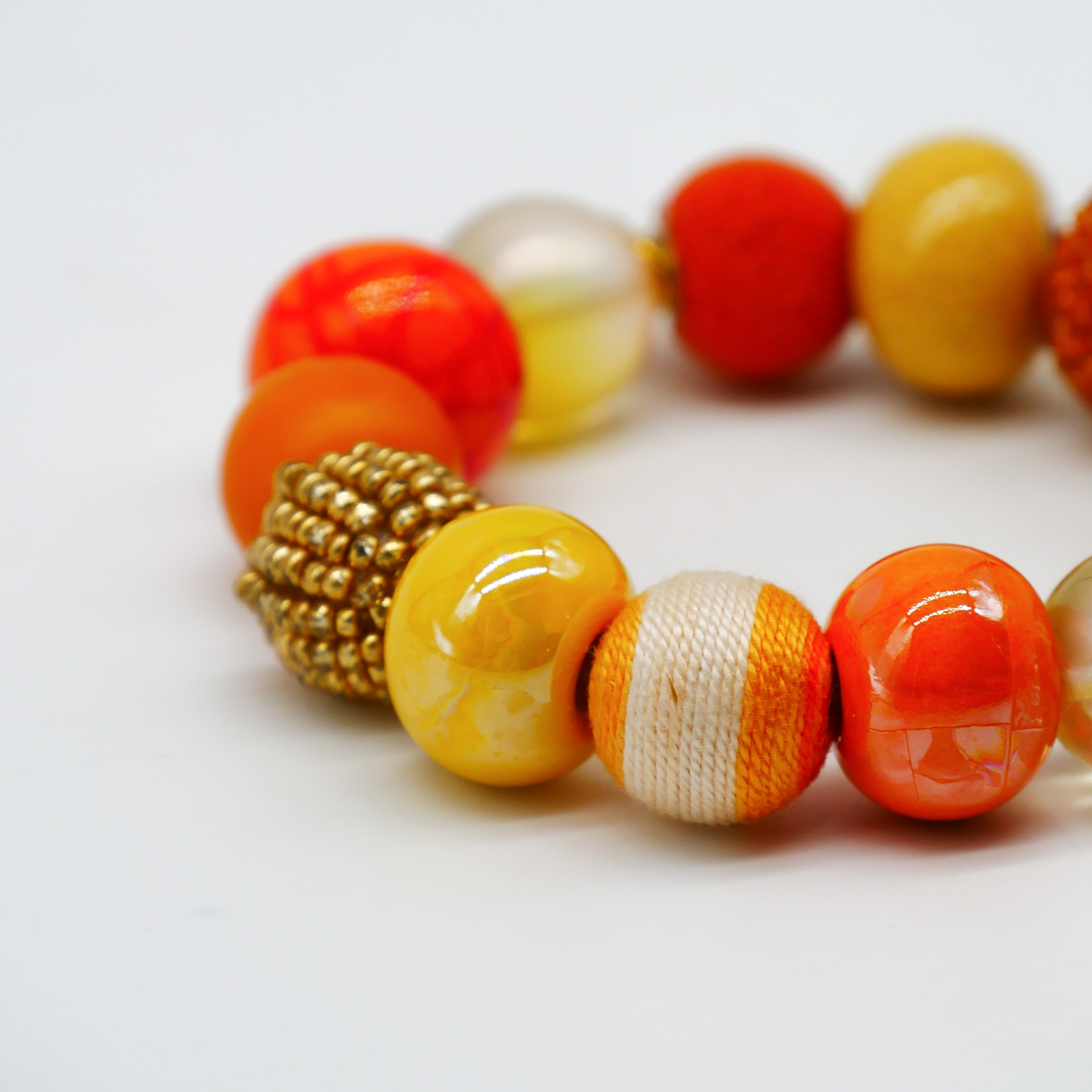  "Bollywood" Armband auf Gummi, gelb-orange