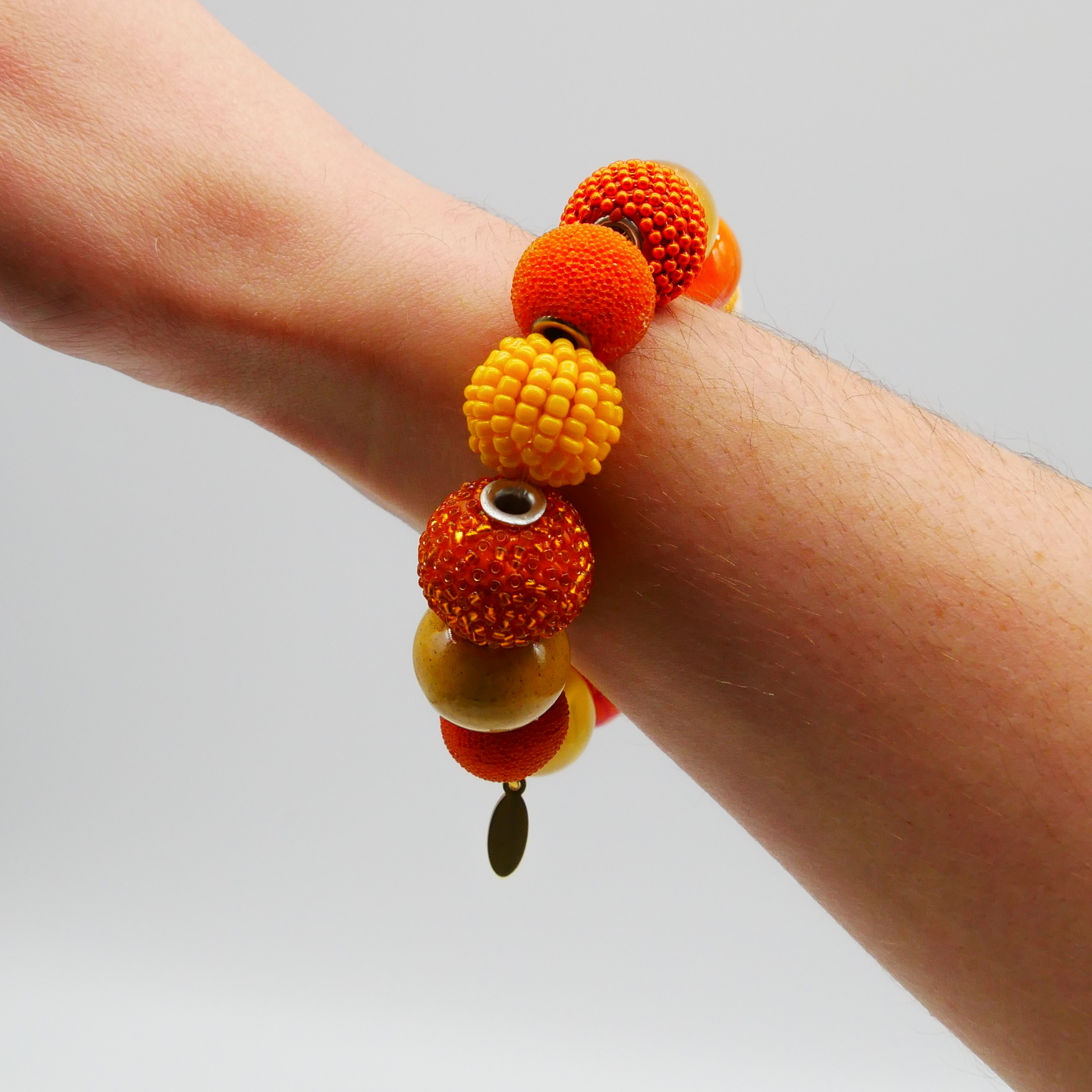  "Bollywood" Armband auf Gummi, gelb-orange