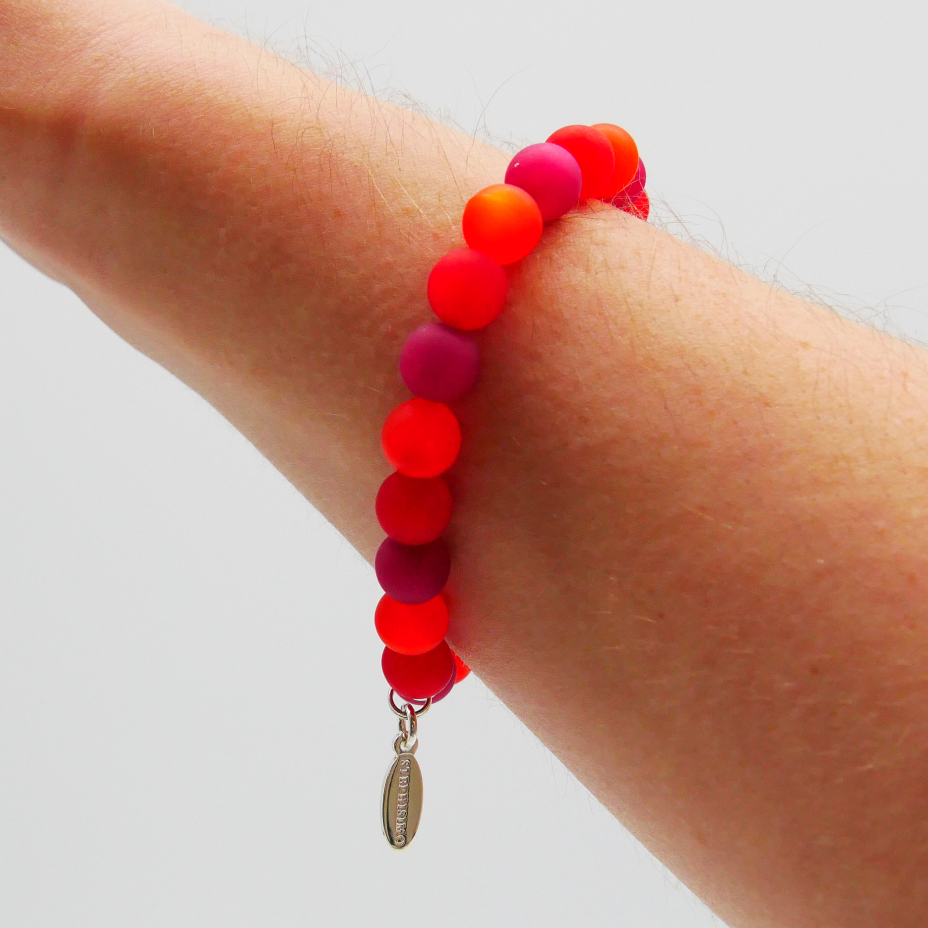  Color Explosion, Armband auf Gummi Ø 8 mm, Glas- und Polaris Perlen, Mars rot-pink