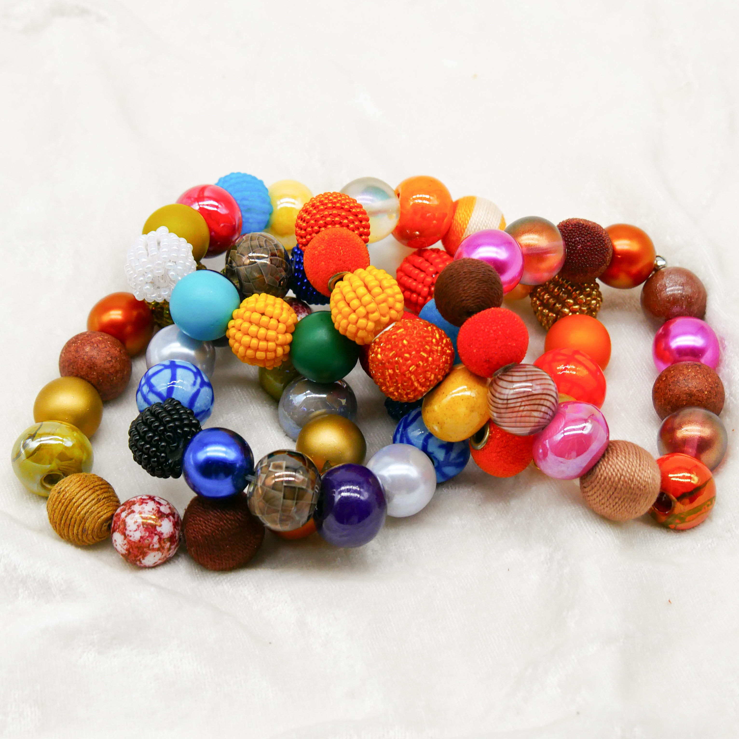  "Bollywood" Armband auf Gummi, gelb-orange