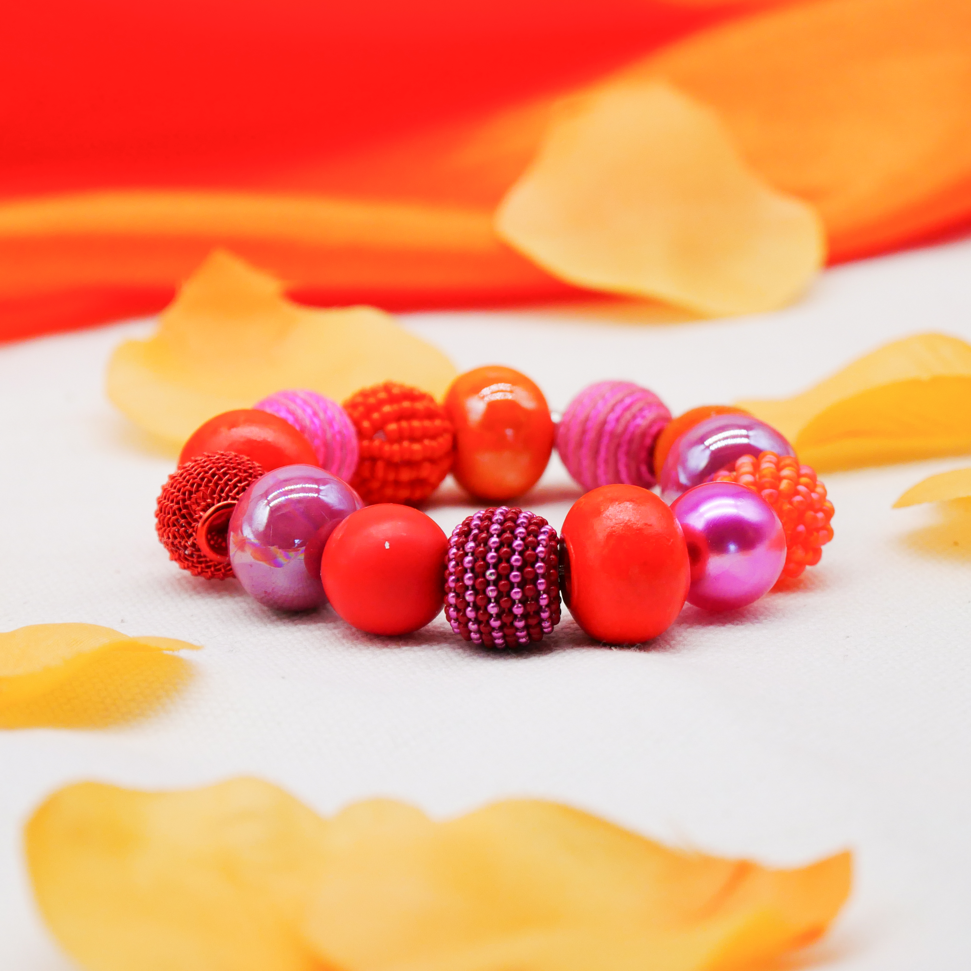  "Bollywood" Armband auf Gummi, pink-orange