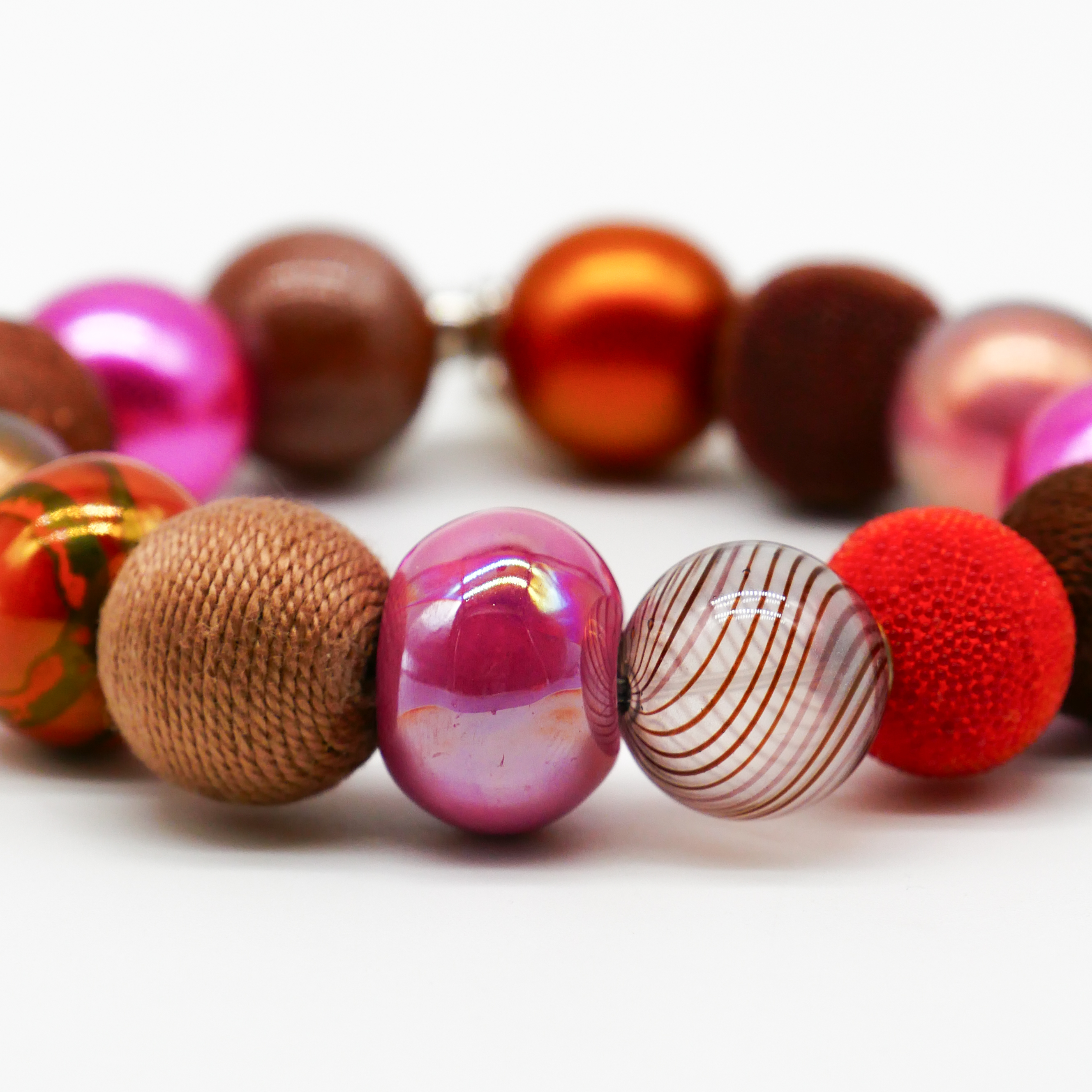  "Bollywood" Armband auf Gummi, braun-pink