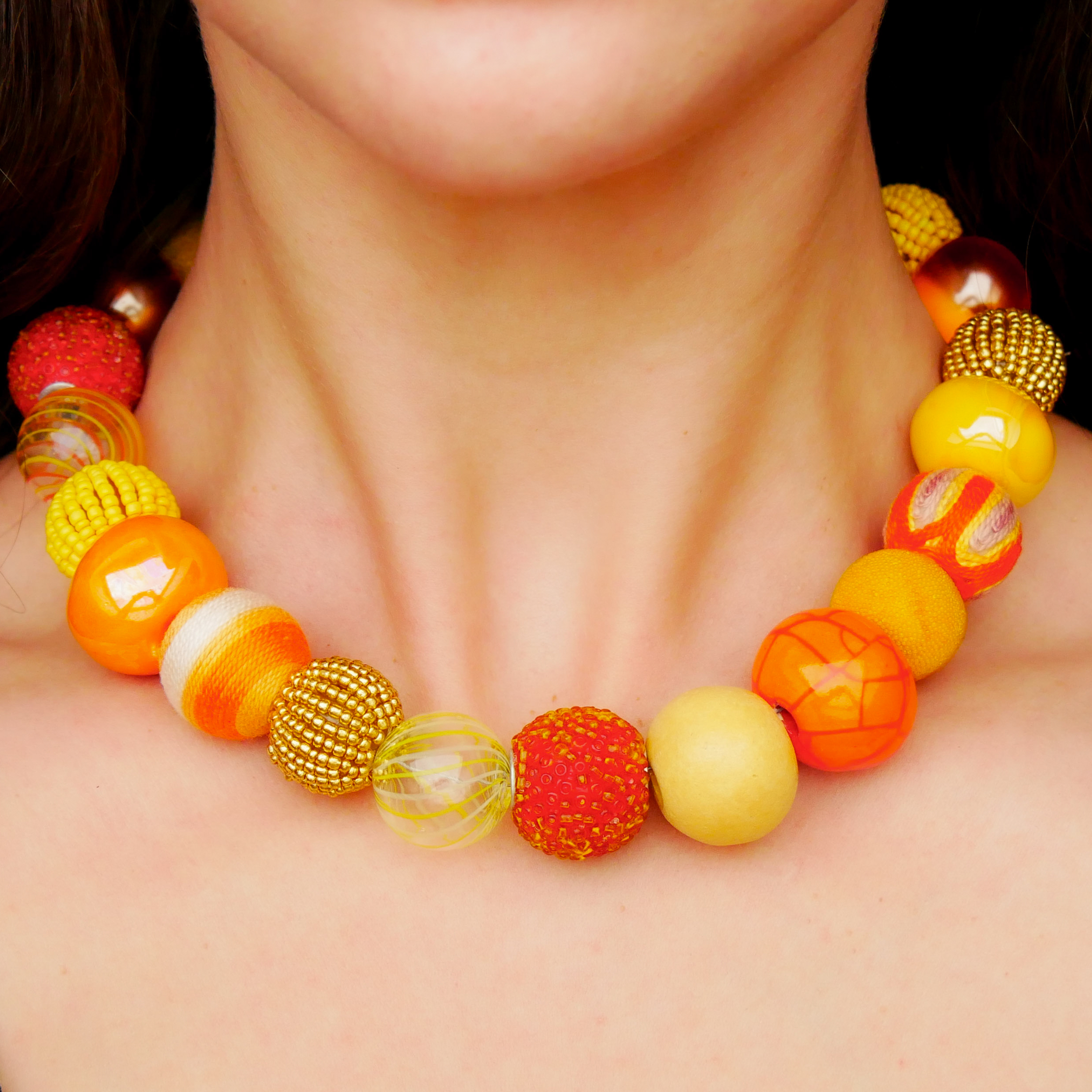 "Bollywood" Kette Ø ca. 20 mm, gelb-orange