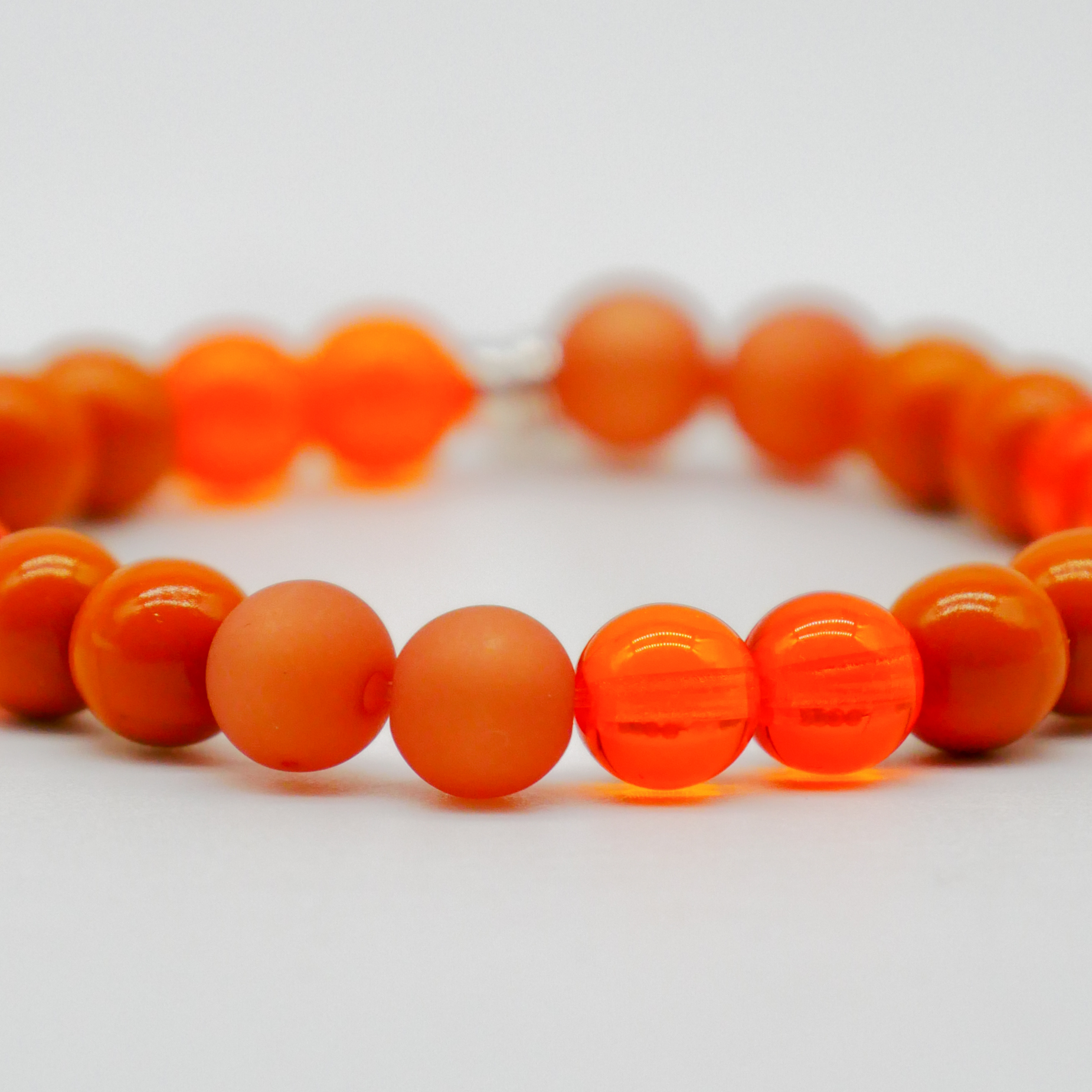  Color Explosion, Armband auf Gummi Ø 8 mm, Glas- und Polaris Perlen, Jupiter orange