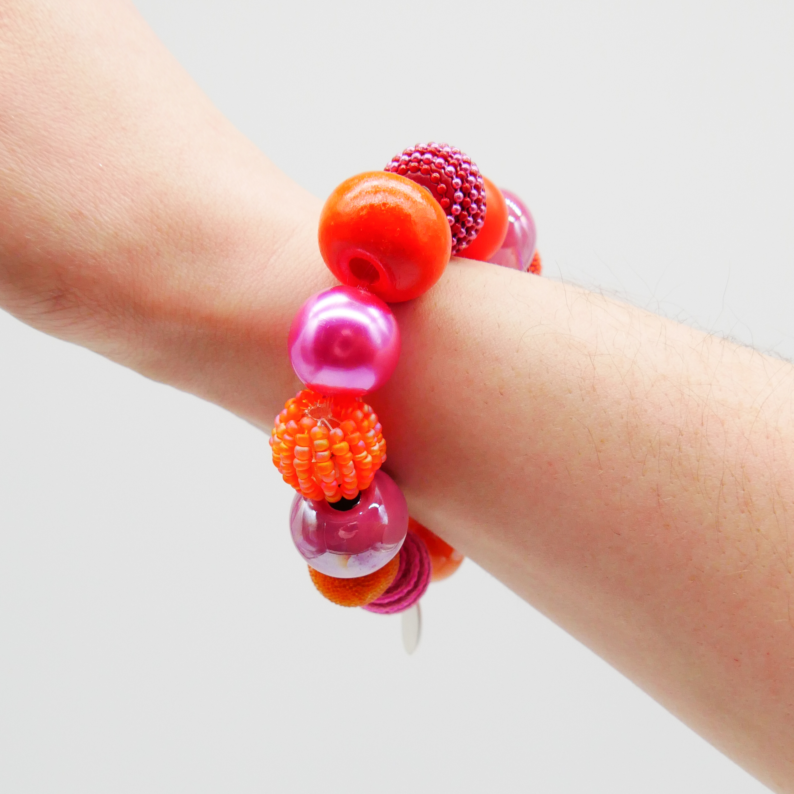  "Bollywood" Armband auf Gummi, pink-orange