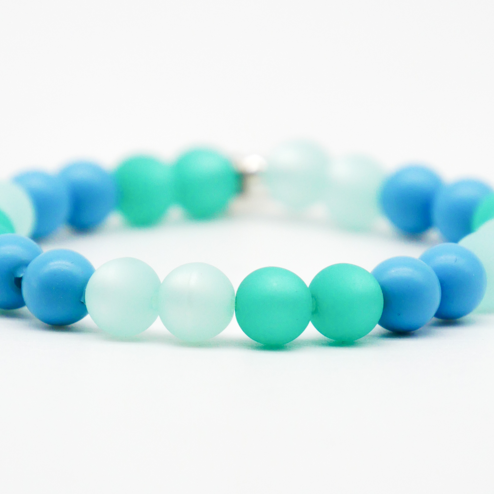  Color Explosion, Armband auf Gummi Ø 8 mm, Glas- und Polaris Perlen, Neptun türkis