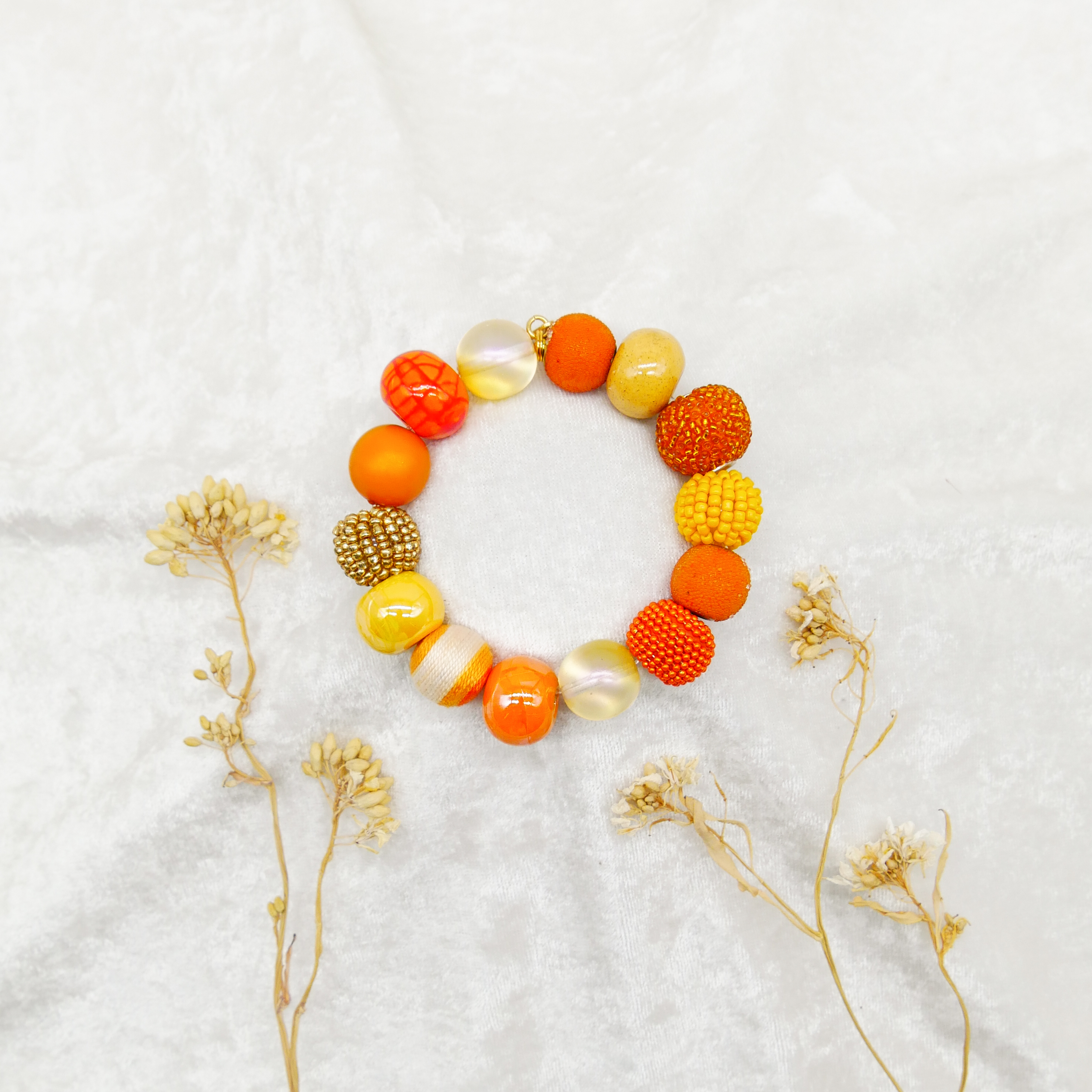  "Bollywood" Armband auf Gummi, gelb-orange