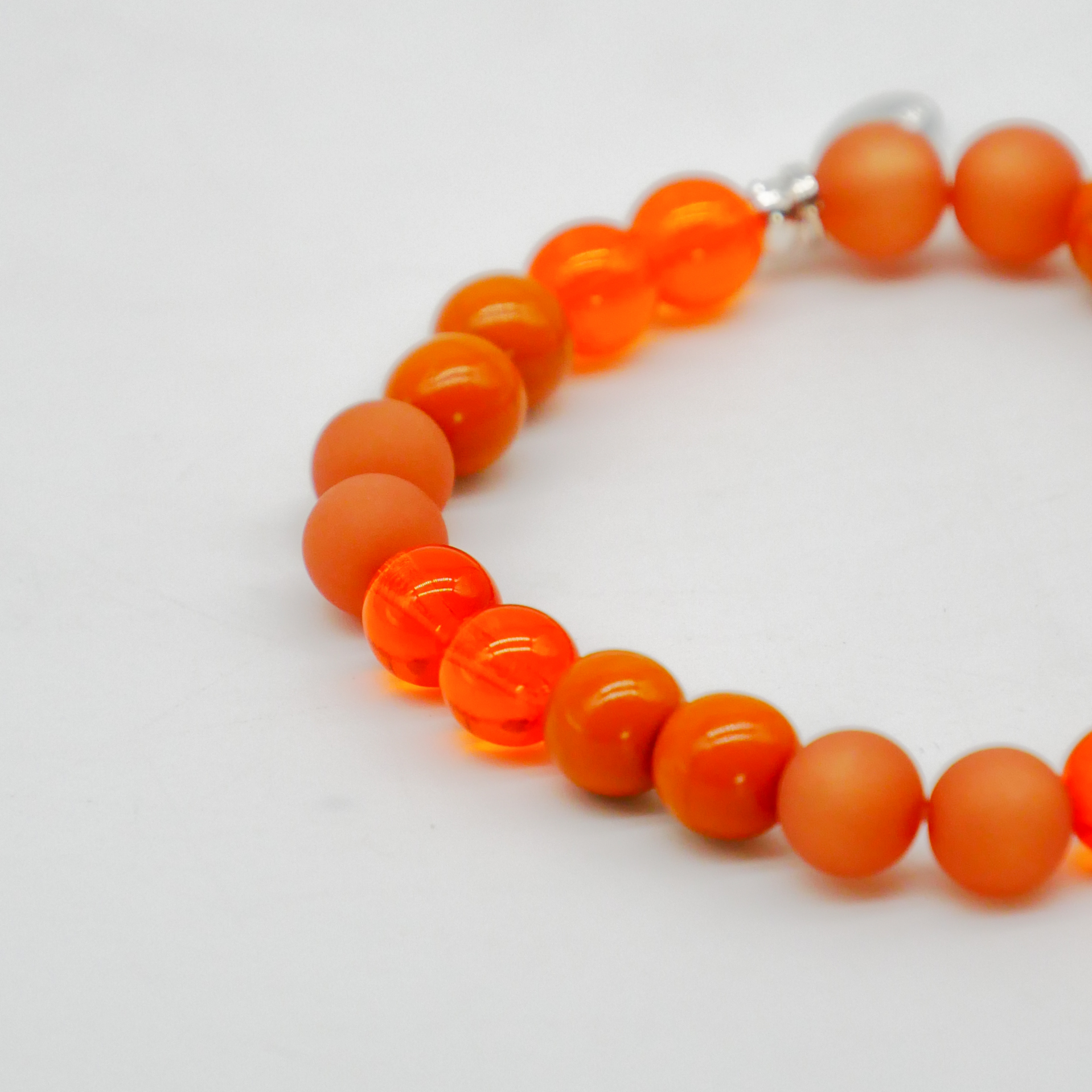  Color Explosion, Armband auf Gummi Ø 8 mm, Glas- und Polaris Perlen, Jupiter orange