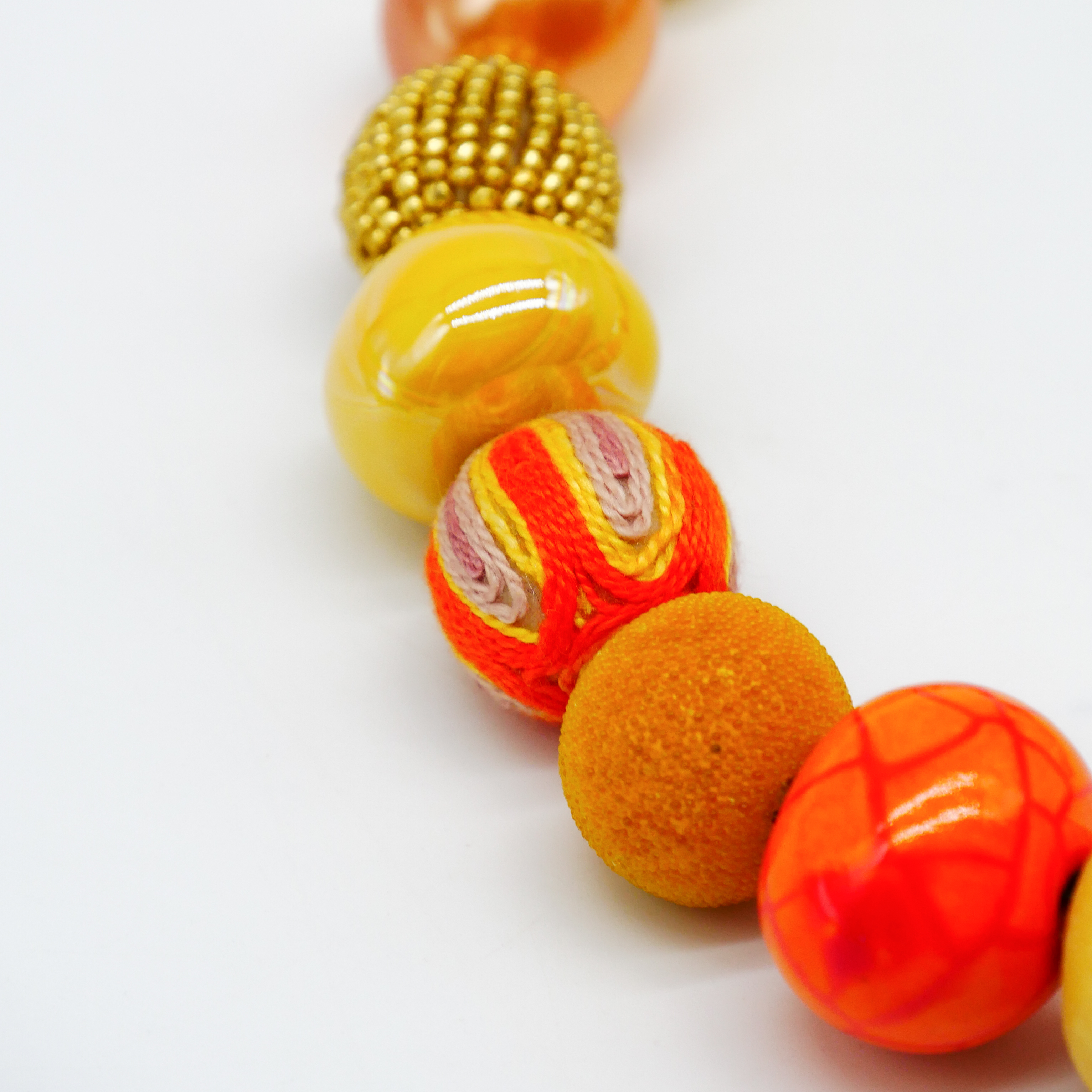 "Bollywood" Kette Ø ca. 20 mm, gelb-orange