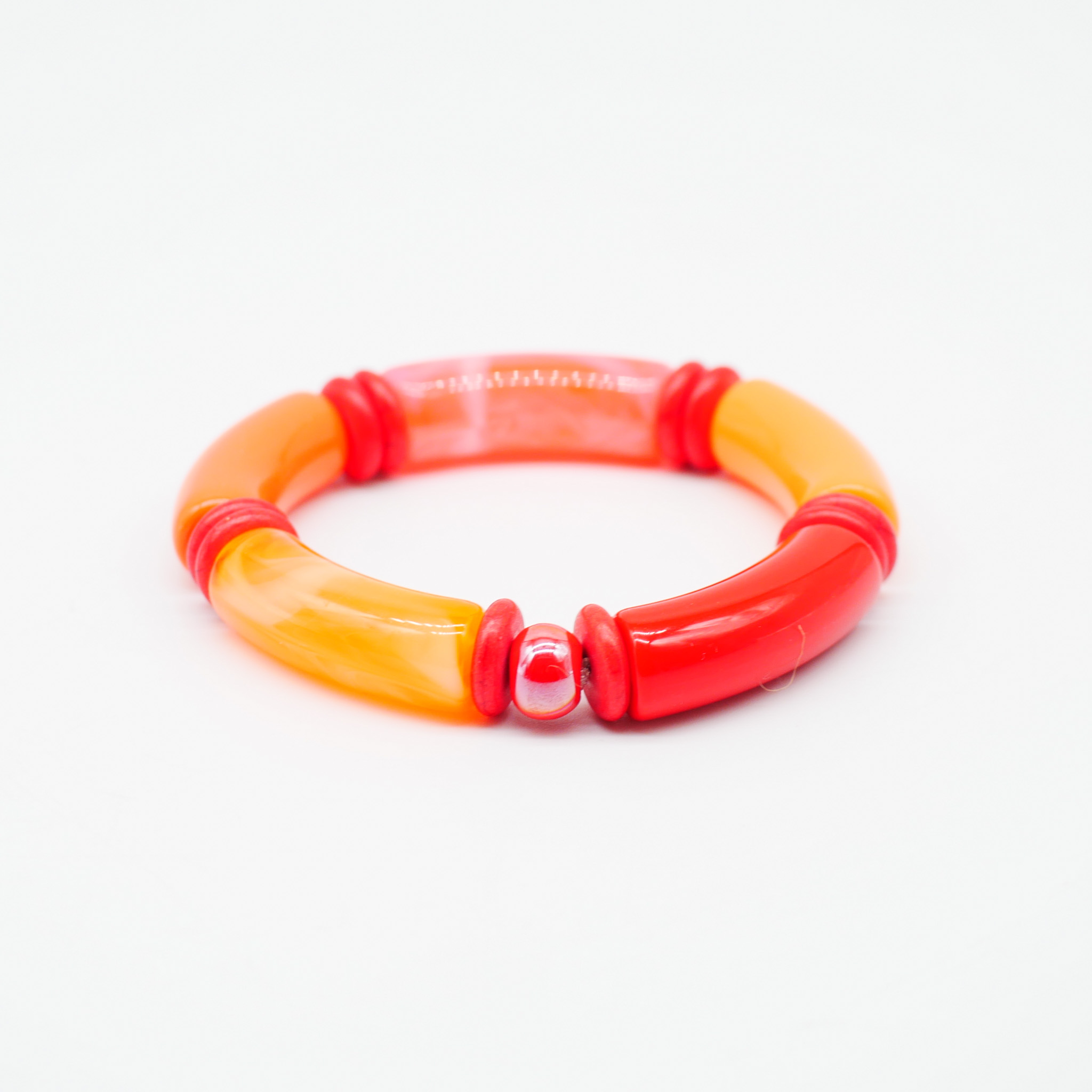 Armband "Tube" auf Gummi, gebogene Kunststoffelemente + Howite, orange