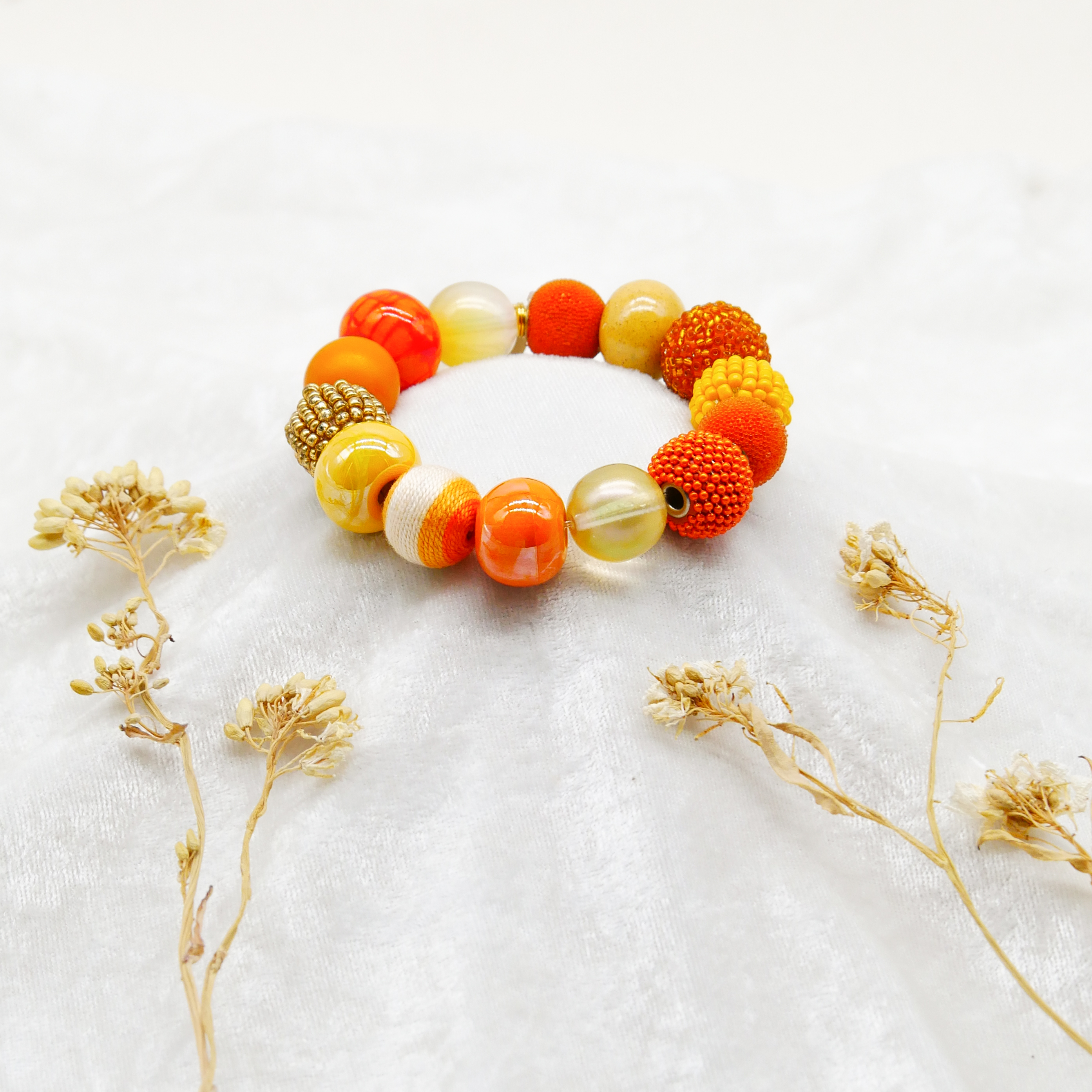  "Bollywood" Armband auf Gummi, gelb-orange