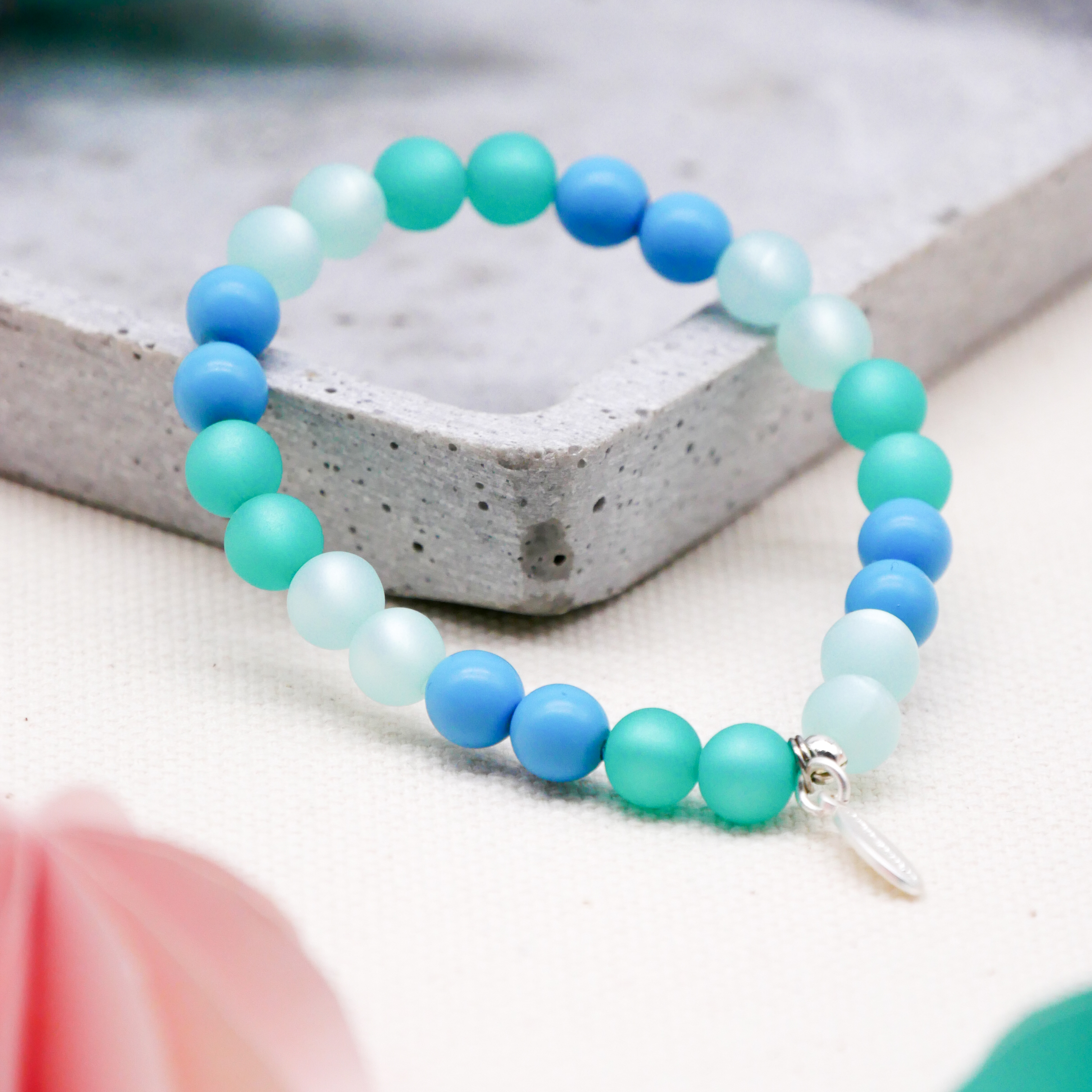  Color Explosion, Armband auf Gummi Ø 8 mm, Glas- und Polaris Perlen, Neptun türkis