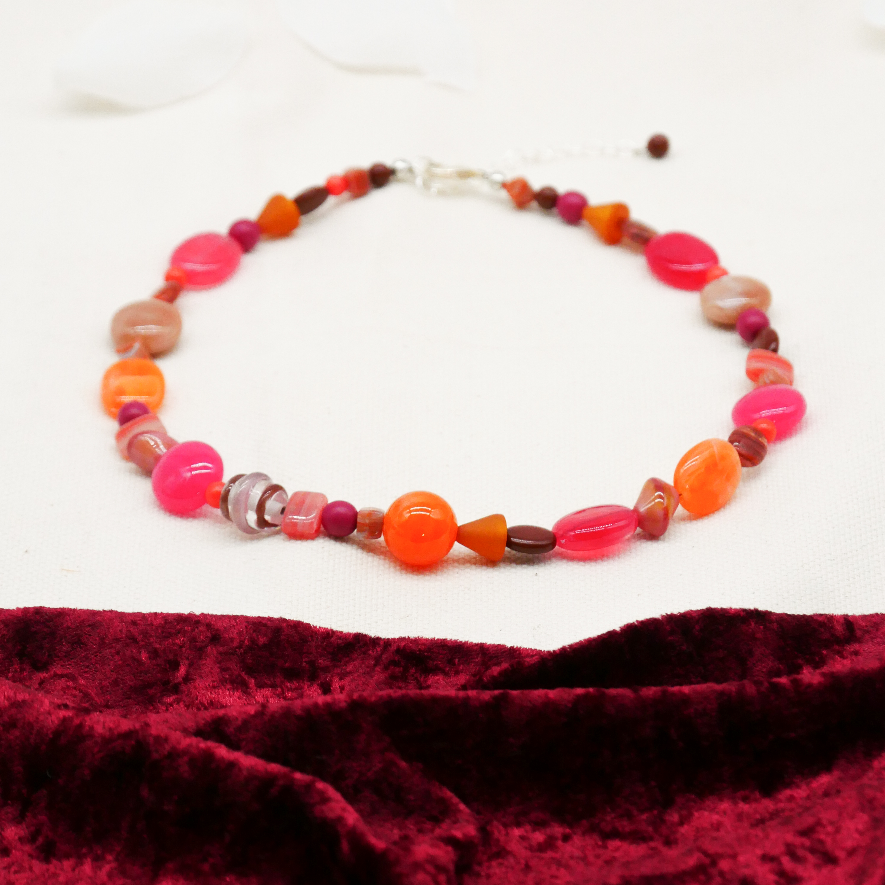 "Summer Feeling",  Chain with different shapes, Glas- and Resin Pearls, pink-orange