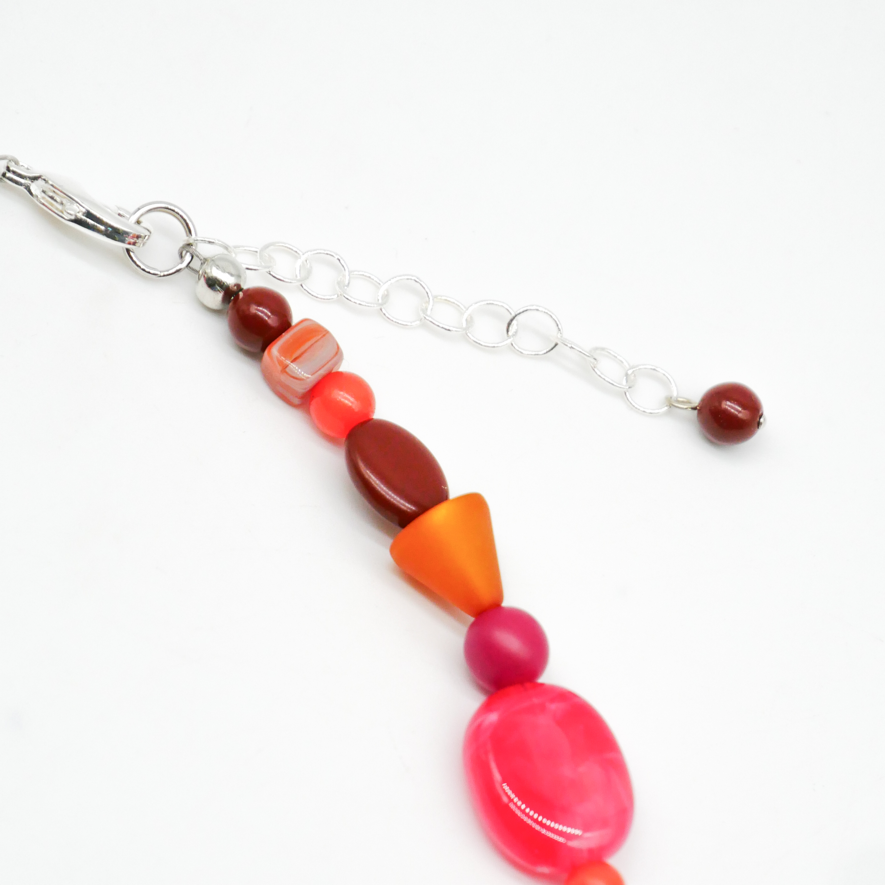 "Summer Feeling",  Chain with different shapes, Glas- and Resin Pearls, pink-orange