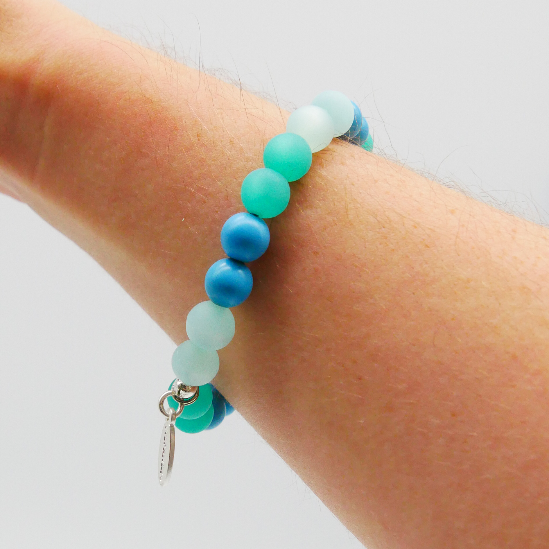  Color Explosion, Armband auf Gummi Ø 8 mm, Glas- und Polaris Perlen, Neptun türkis