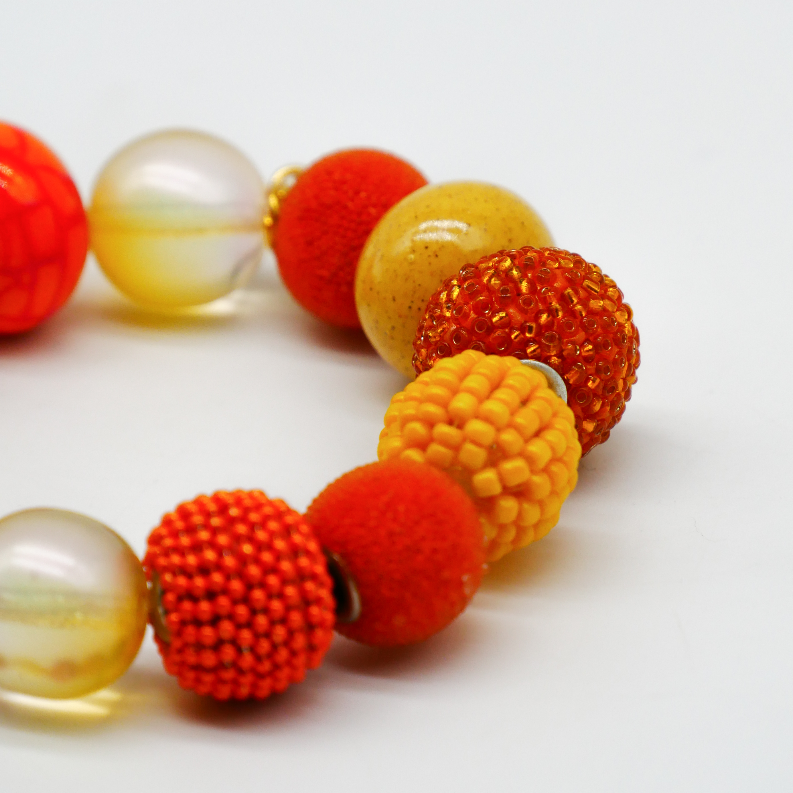  "Bollywood" Armband auf Gummi, gelb-orange