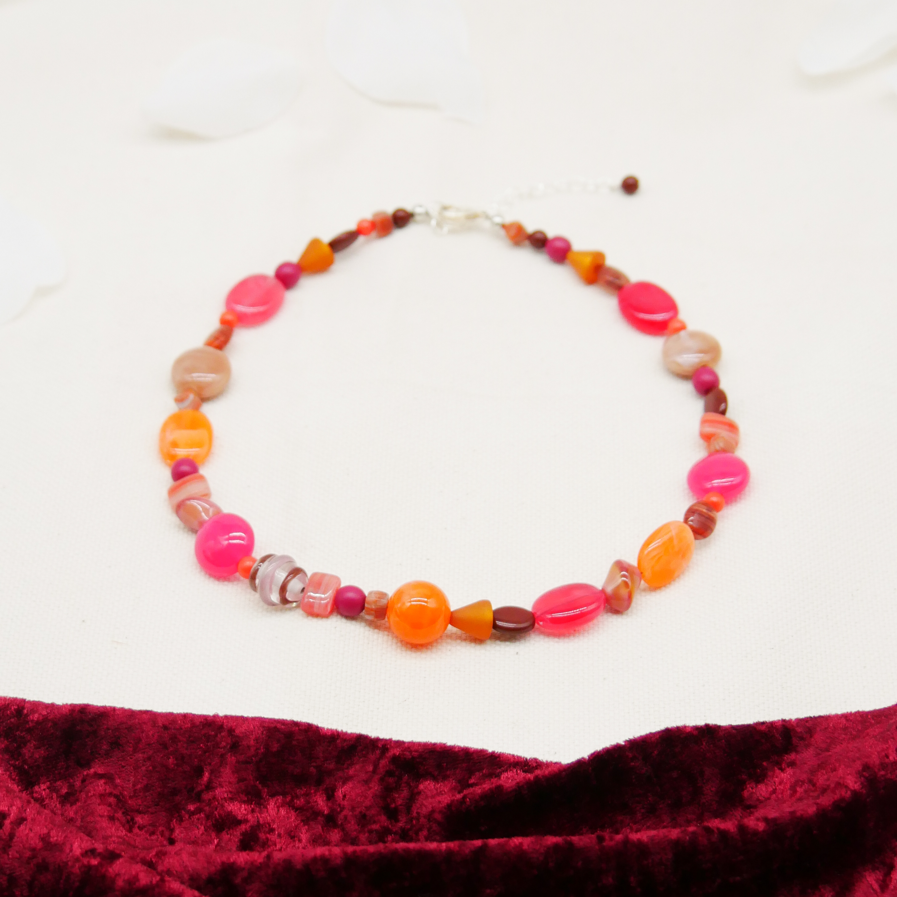 "Summer Feeling",  Chain with different shapes, Glas- and Resin Pearls, pink-orange