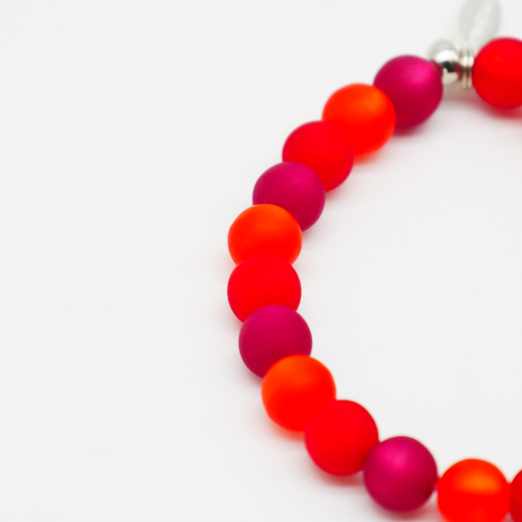  Color Explosion, Armband auf Gummi Ø 8 mm, Glas- und Polaris Perlen, Mars rot-pink