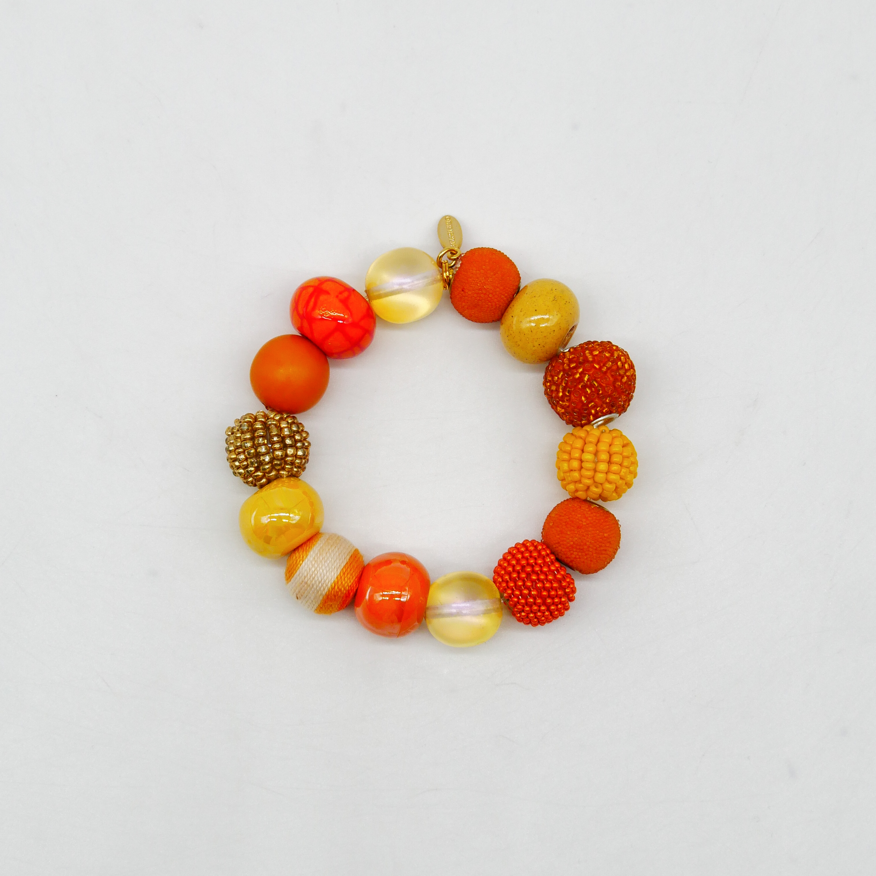  "Bollywood" Armband auf Gummi, gelb-orange