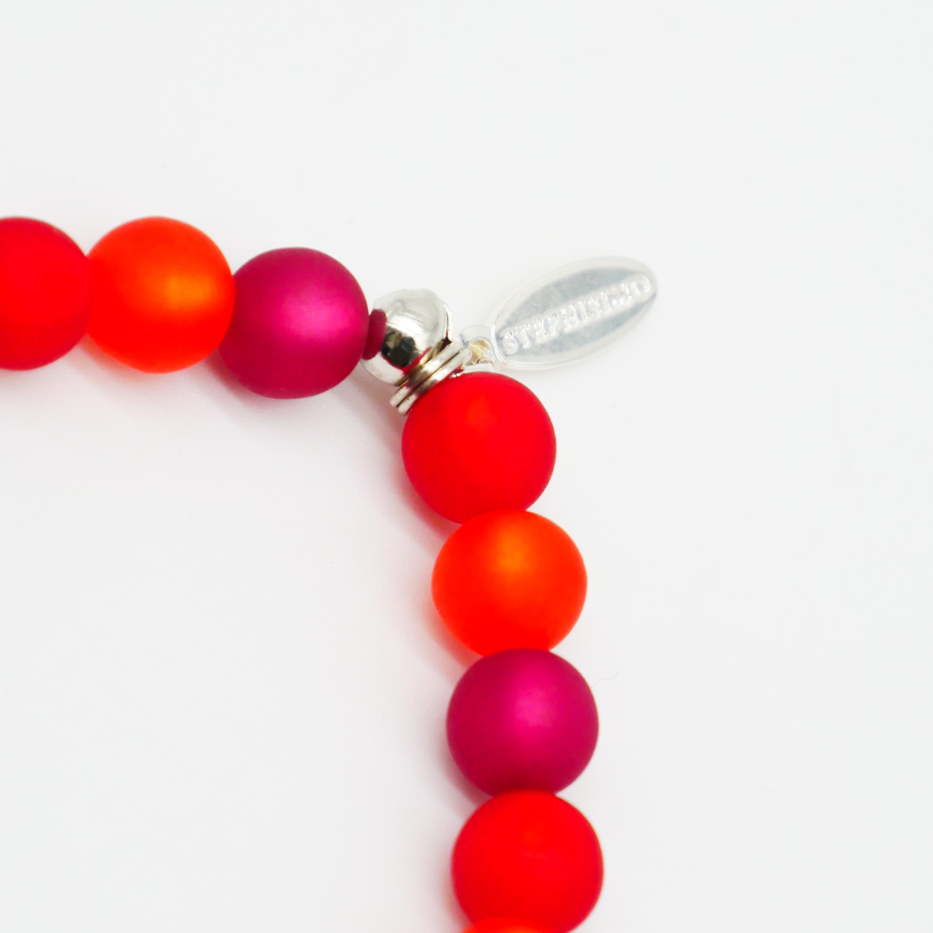  Color Explosion, Armband auf Gummi Ø 8 mm, Glas- und Polaris Perlen, Mars rot-pink